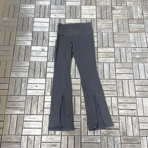Black mid-rise split-hem leggings/yoga pants.